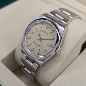 Rolex Oyster Perpetual Beige 126000 right side case